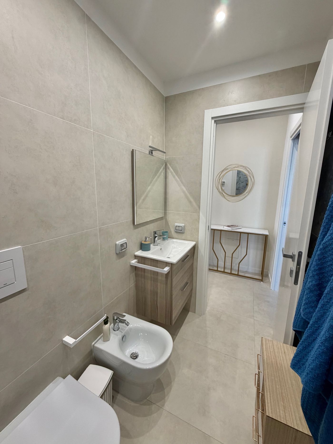 Bright new bathroom with washbasin, bidet and mirror