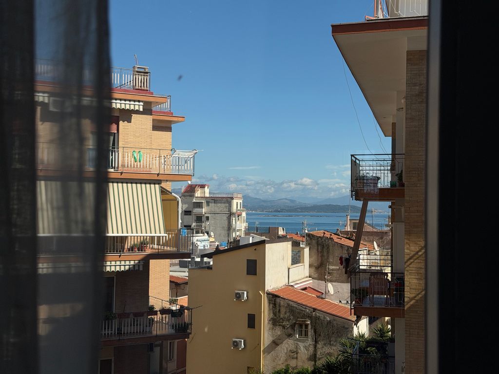 The bay of Gaeta seen between buildings from the apartment window